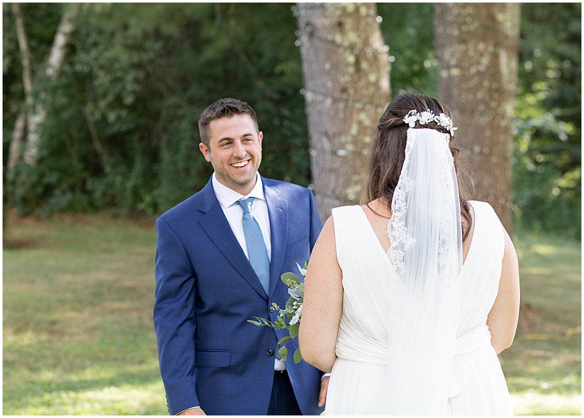 Intimate backyard wedding Mendon bride and groom first look