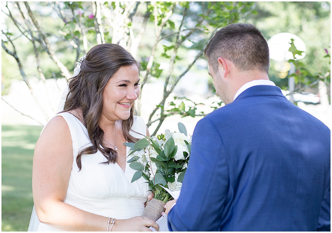 Intimate backyard wedding Mendon, bride and groom exchanging vows