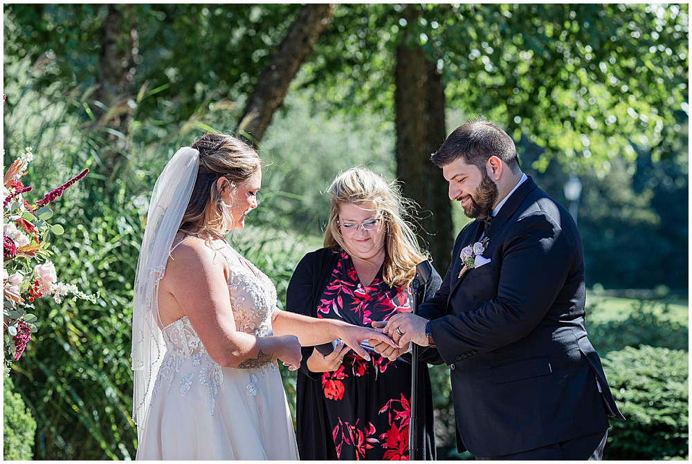 Atkinson Country Club wedding ceremony at the trellis in the fall